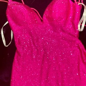 Sherri Hill dress in bright pink with rhinestone detailing, mermaid fit